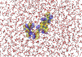 A snapshot of the hybrid quantum/ classical simulation for ATP4- placed in water solvent